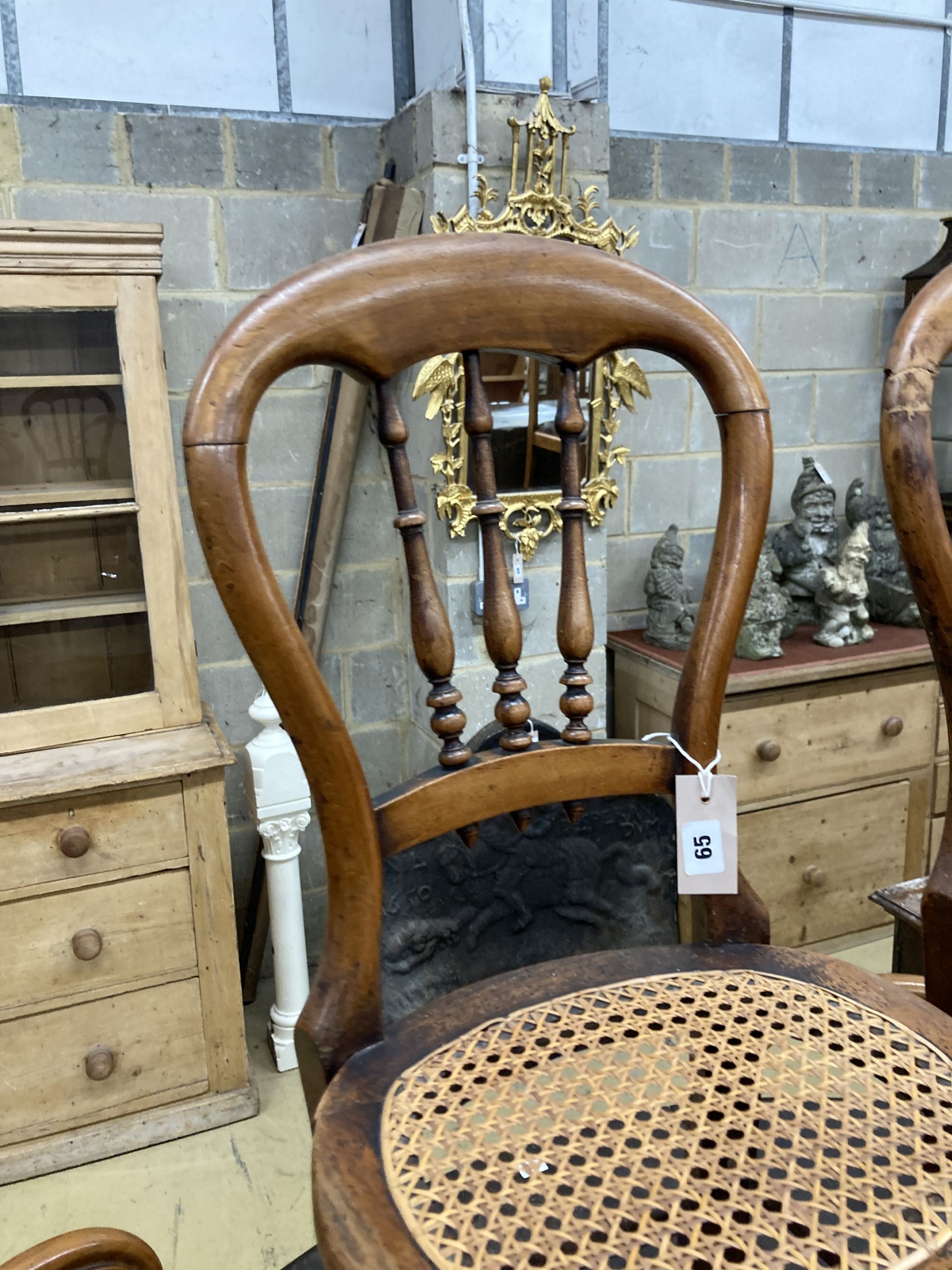 A pair of Victorian spindle back cane seat correction chairs